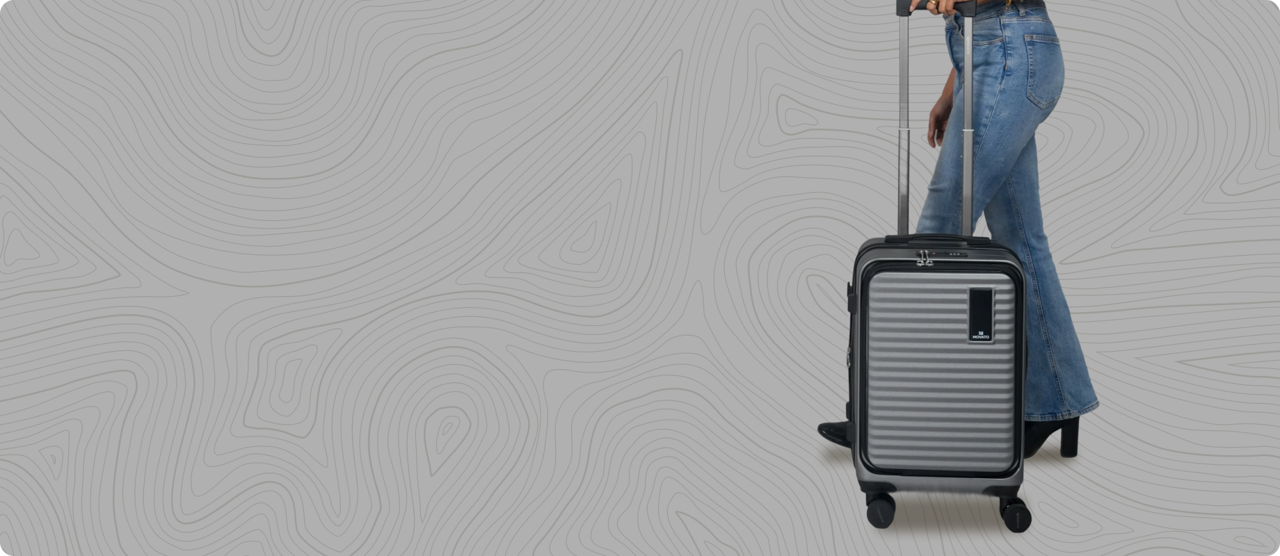 Person pulling a suitcase on a textured gray background